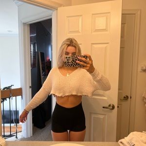 cream colored cropped sweater with fringe